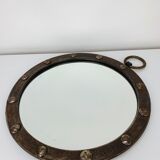 Round wrought iron porthole mirror