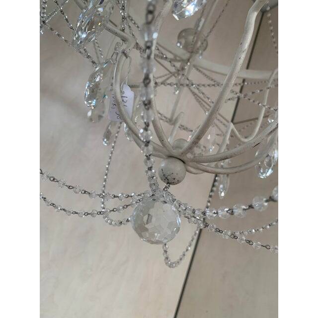 Contemporary ivory florentine iron and crystals chandelier
