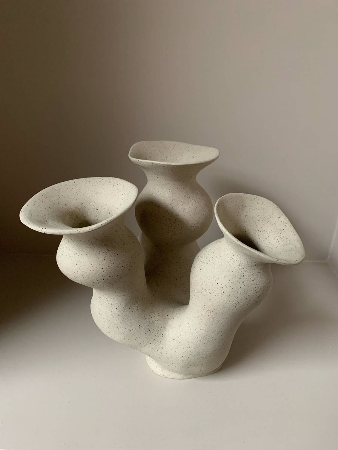 Organic-shaped vase in pyritic stoneware.