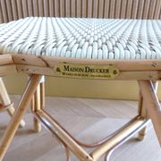 Pair of Parisian bistro chairs from Maison Louis Drucker in light Manila rattan.