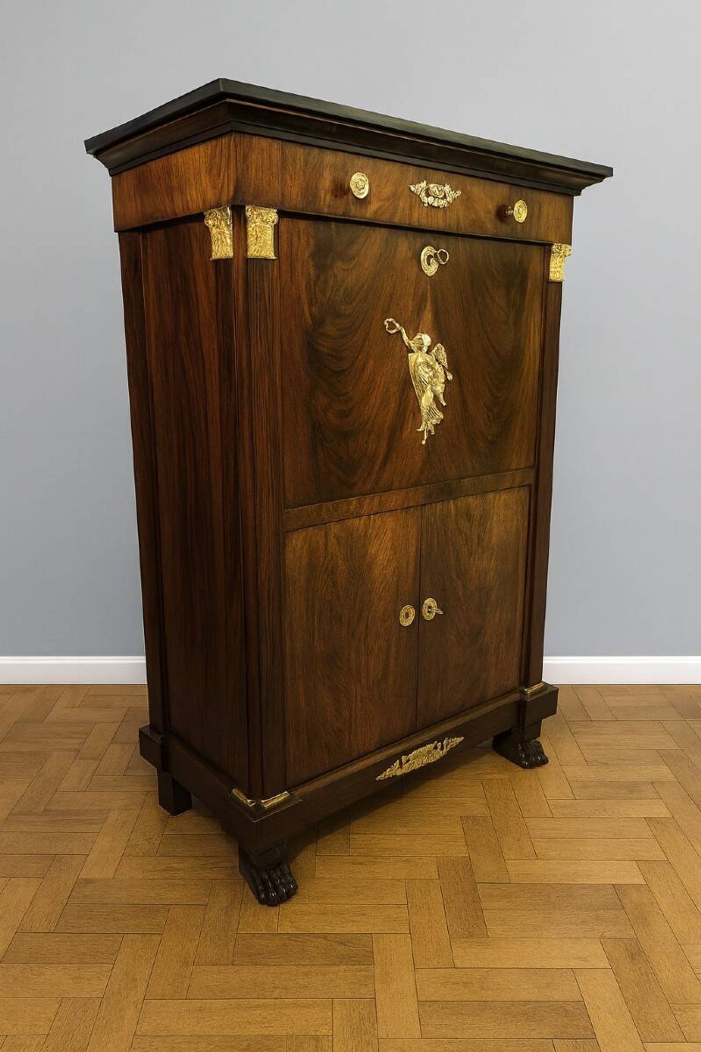 Rare Empire period mahogany secretary with four columns topped with bronze capitals.