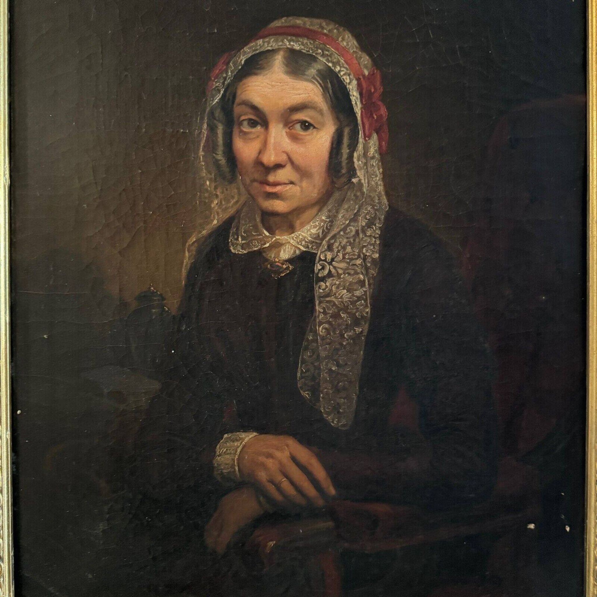 Late 19th century portrait representing a woman with a headdress and lace