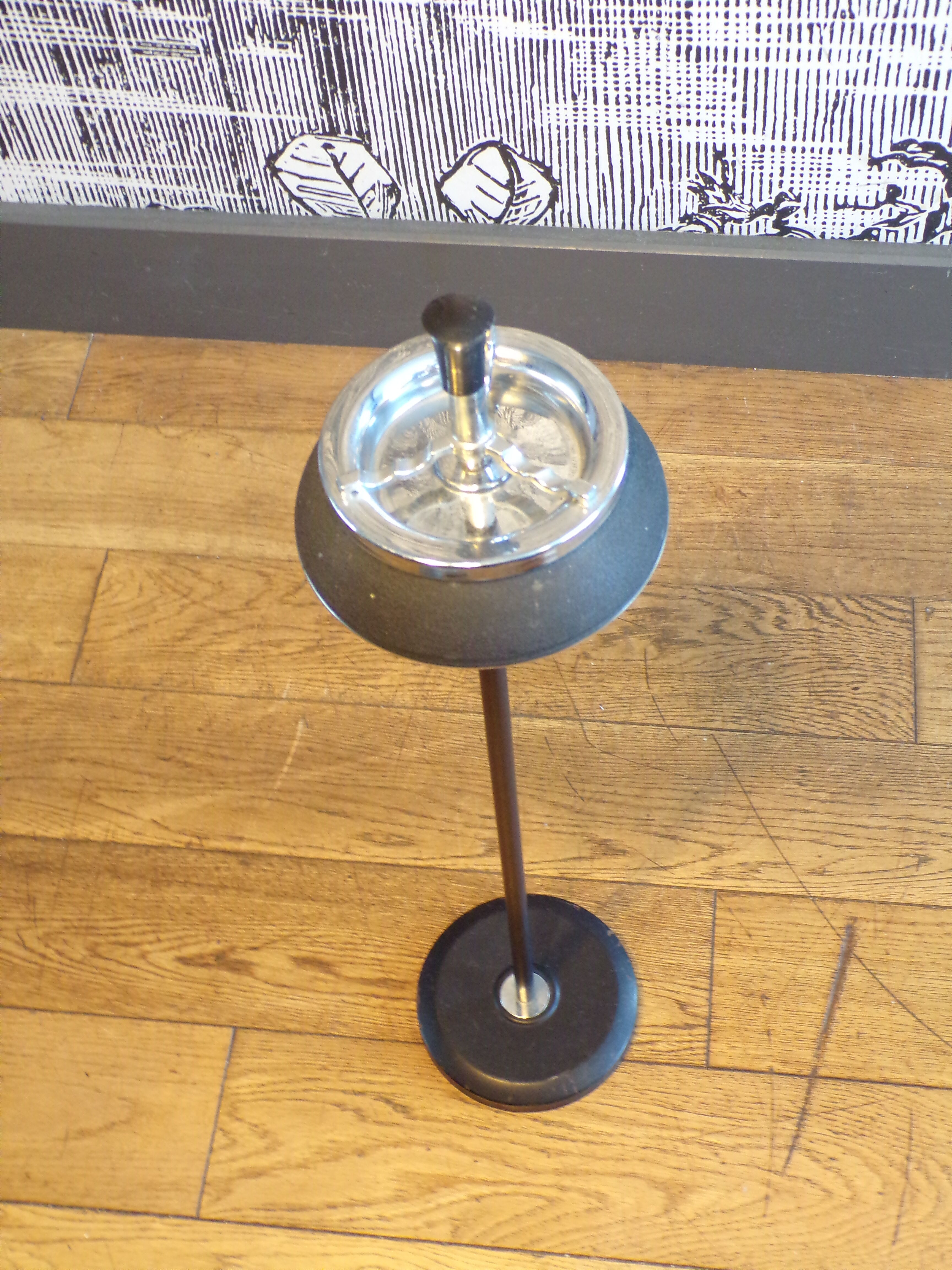 Vintage push-up ashtray on foot