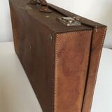 Suitcase of leather with labels of palaces