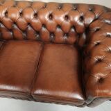 Brown leather chesterfield sofa