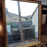 Miroir en bois, doré à la feuille d'or.