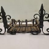 pair of chenets with iron grid and drawer