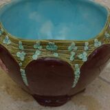Old earthenware cachepot with flower decoration