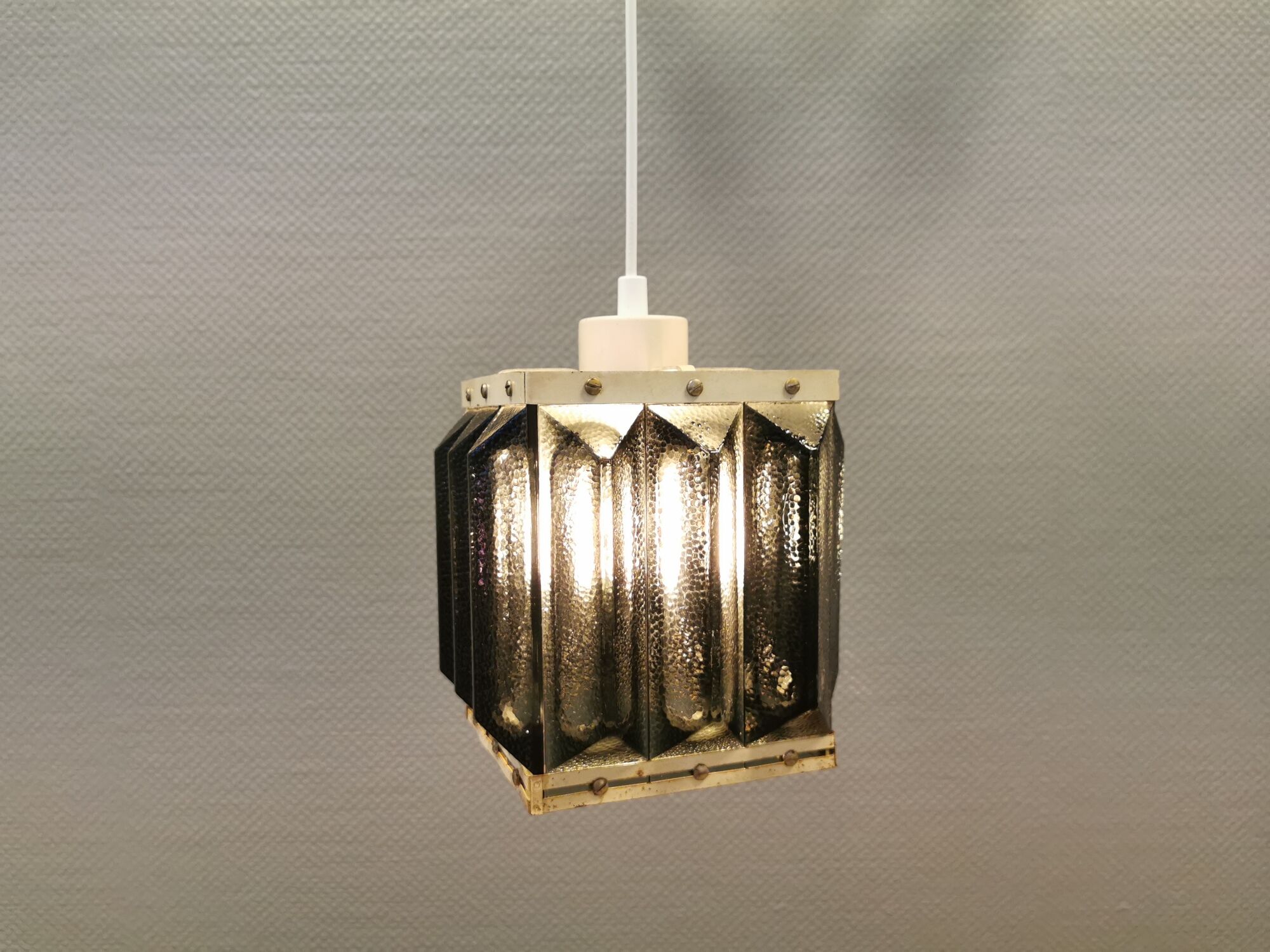 Old Swedish lamp made of metal and smoked solid glass pieces.