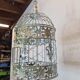Round weathered iron birdcage