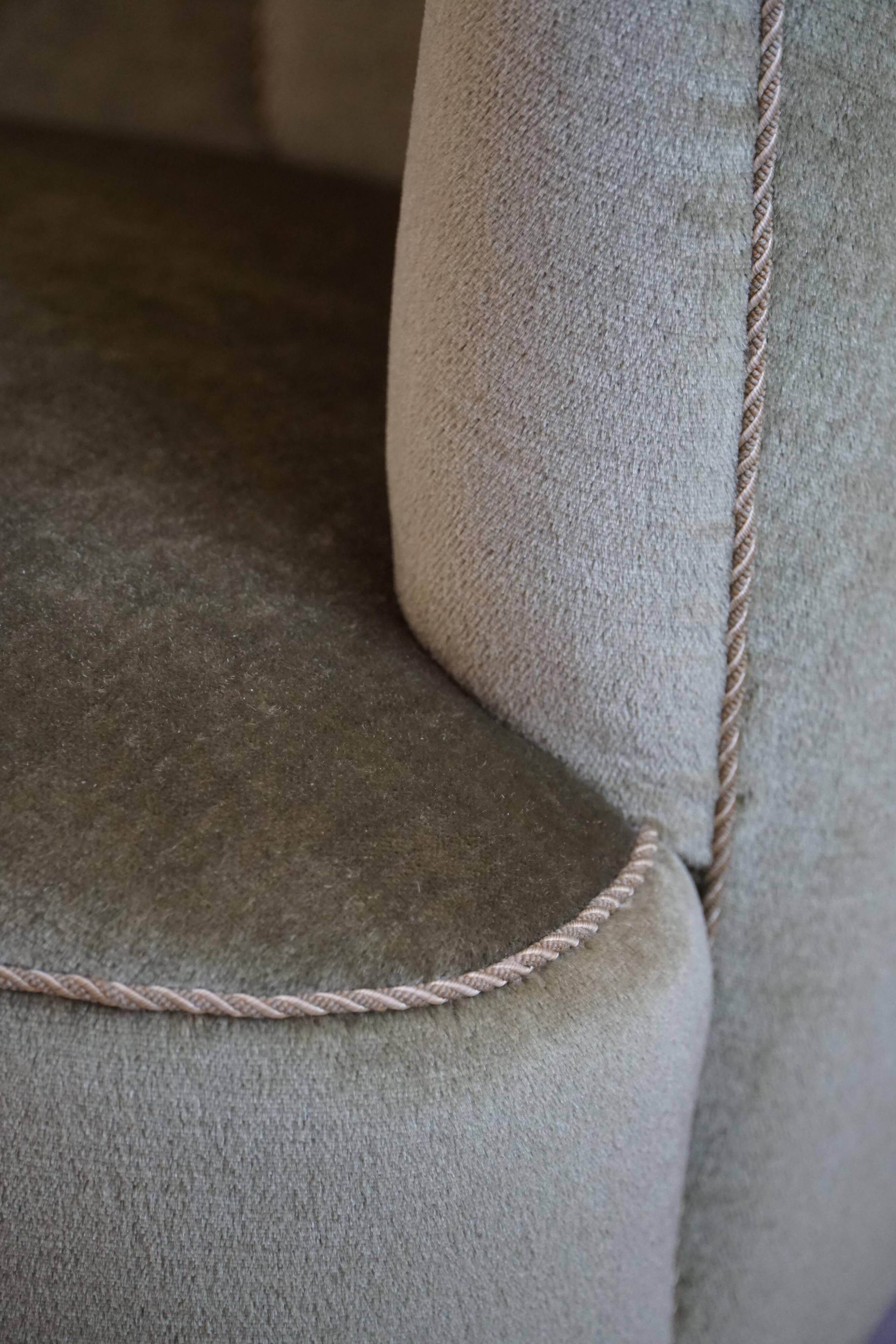 Curved Danish club chair from the mid-century, in the style of Viggo Boesen, 1940s.