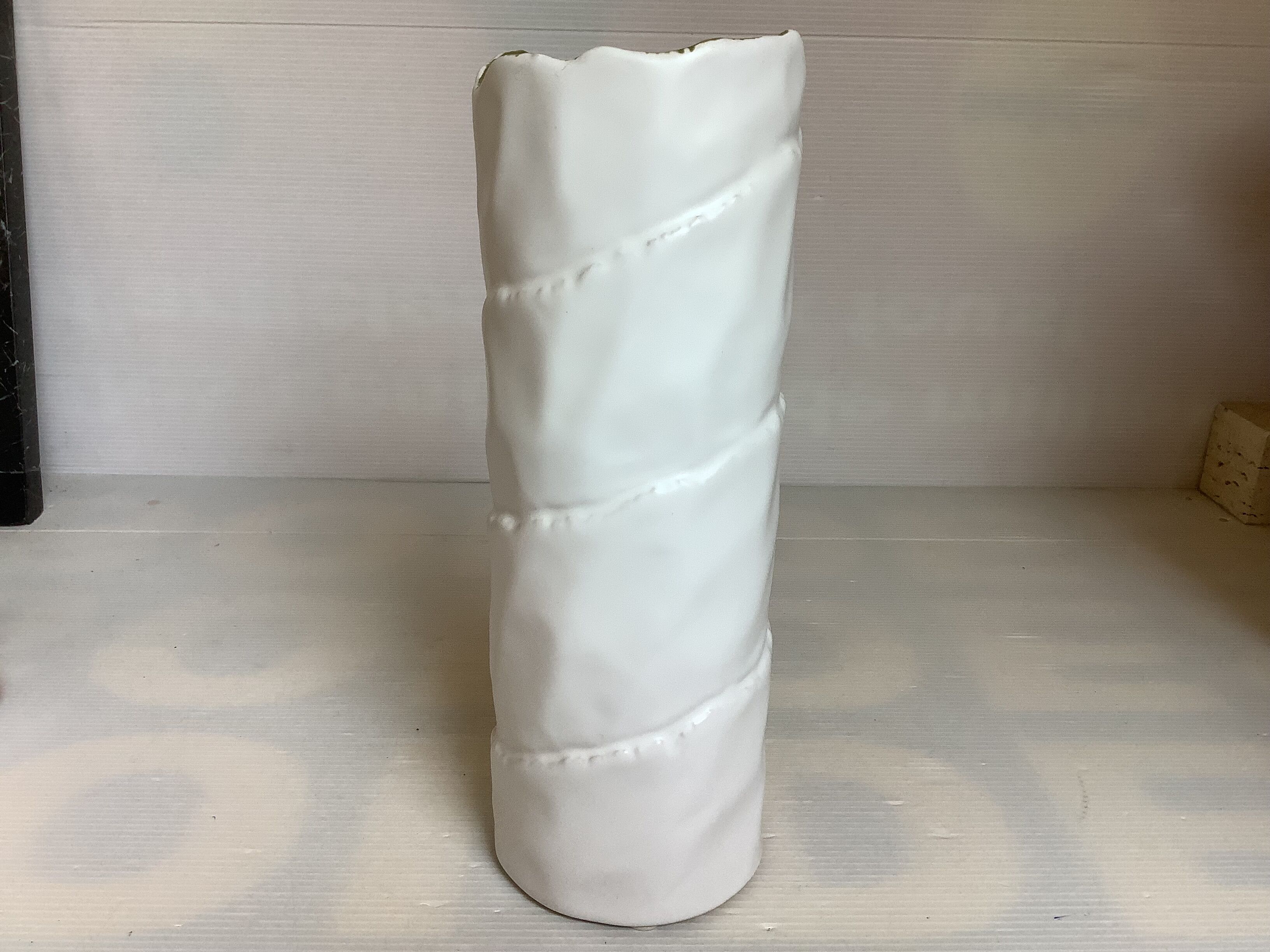 Vase with patterns of rolled paper leaves