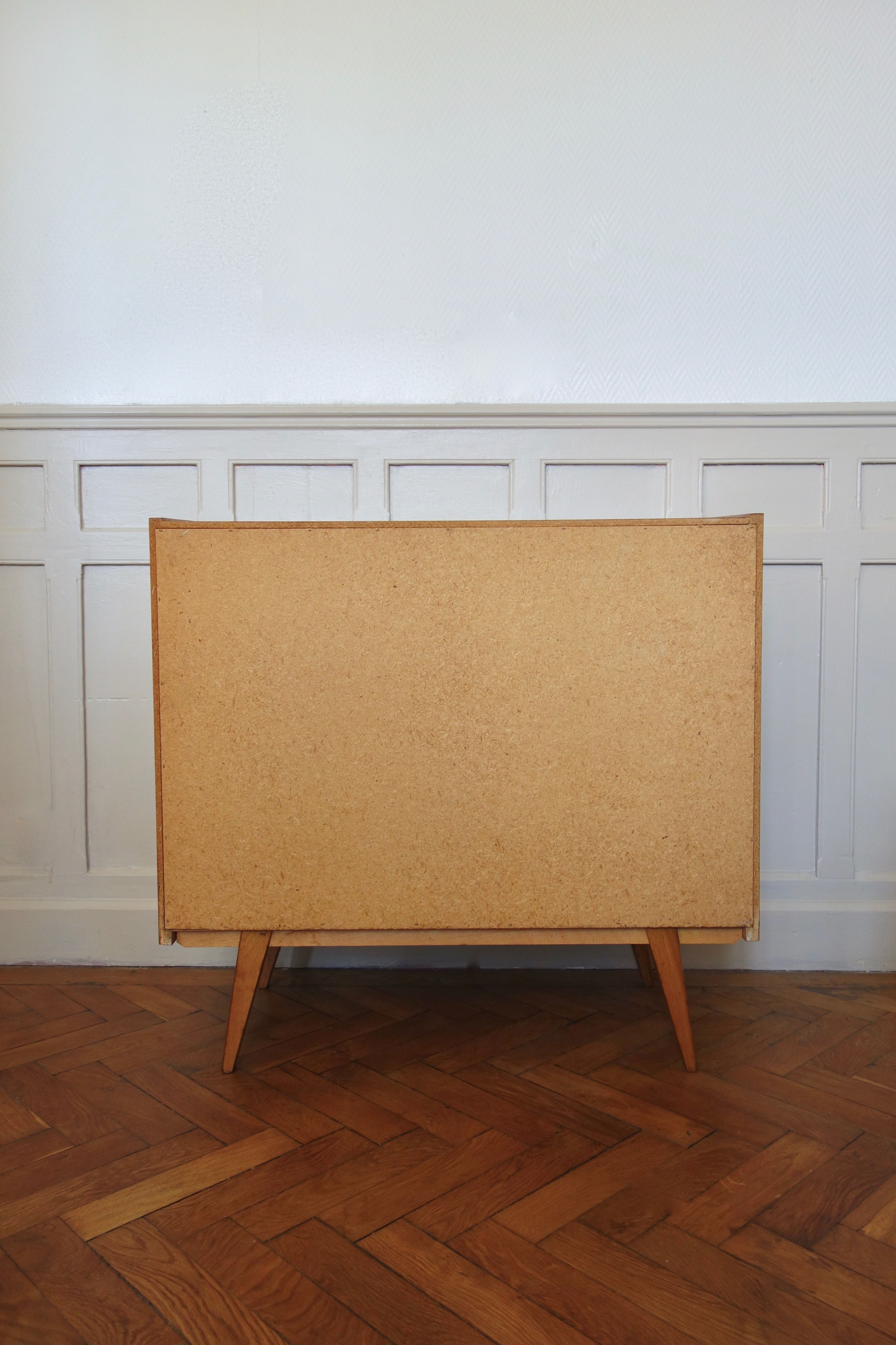 Chest of drawers in oak with compass feet of the 1950s