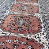 Vintage hand knotted rug with geometric patterns on a grey/beige/terracotta background 170 x 96 cm