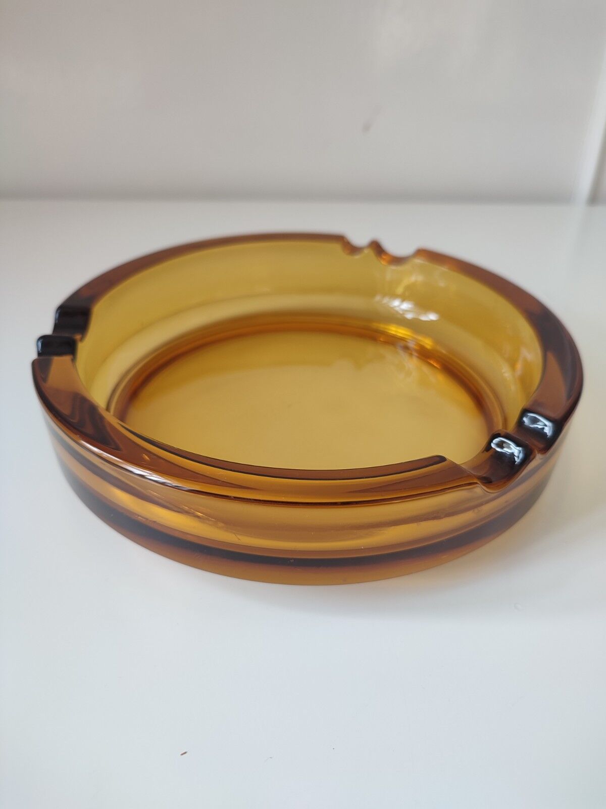 Amber glass ashtray