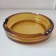 Amber glass ashtray
