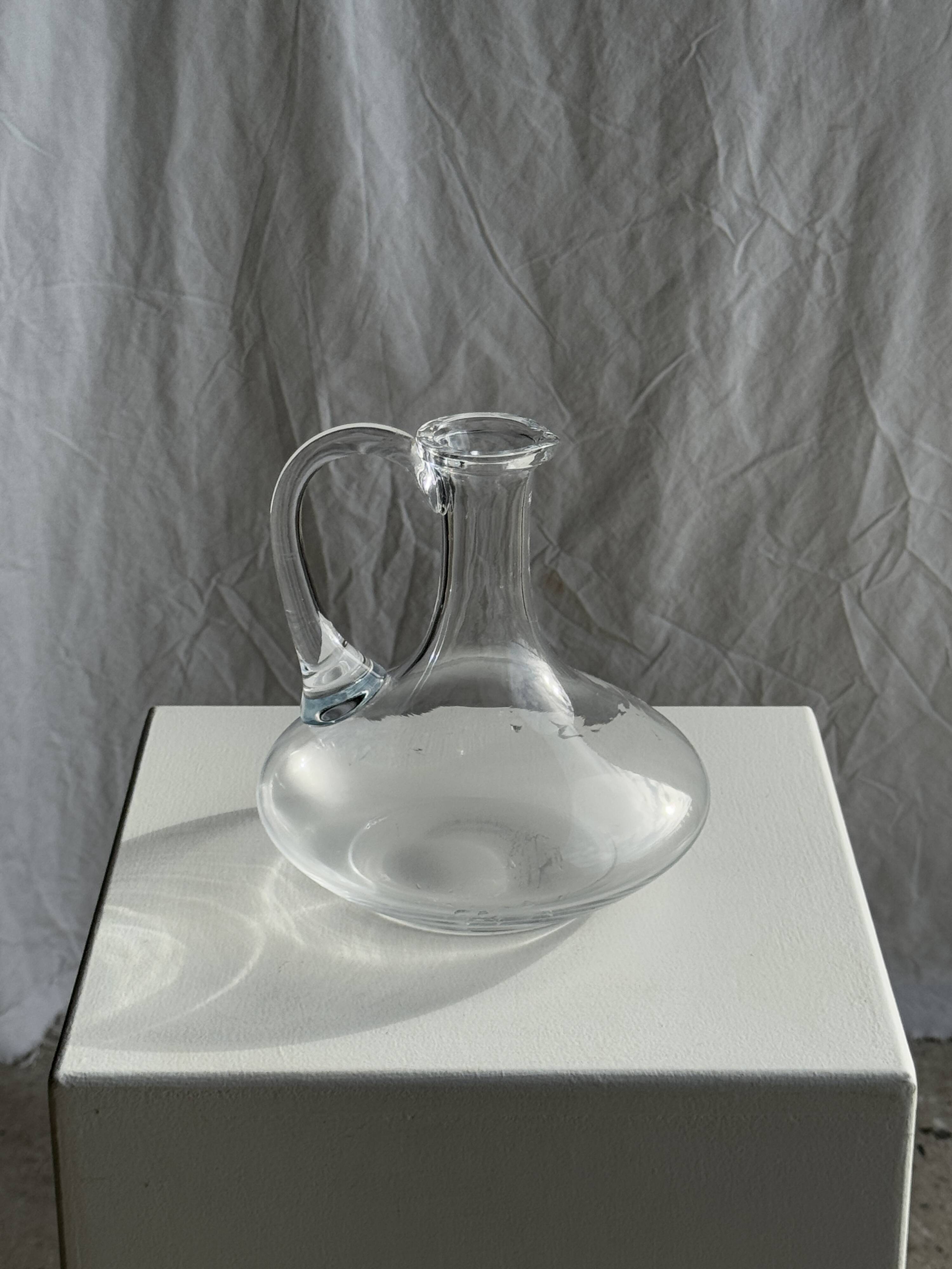 Vintage glass carafe with flattened flared belly handle H18