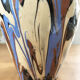 Vase dripping in varnished earth