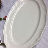 Old ivory-colored, oval-shaped dish with chamfered edge