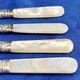 4 antique butter spreading knives in silver-plated metal and mother-of-pearl.