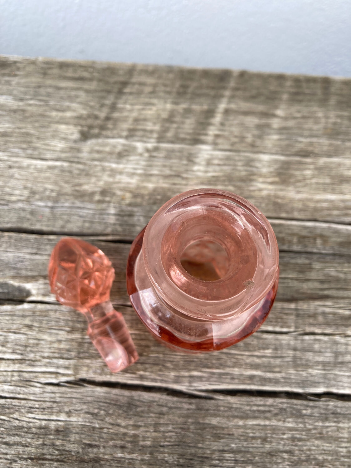 Art Deco perfume bottle in old amber pink glass