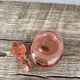 Art Deco perfume bottle in old amber pink glass