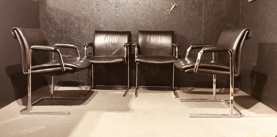 Pair of black leather Scandinavian armchairs