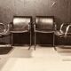 Pair of black leather Scandinavian armchairs