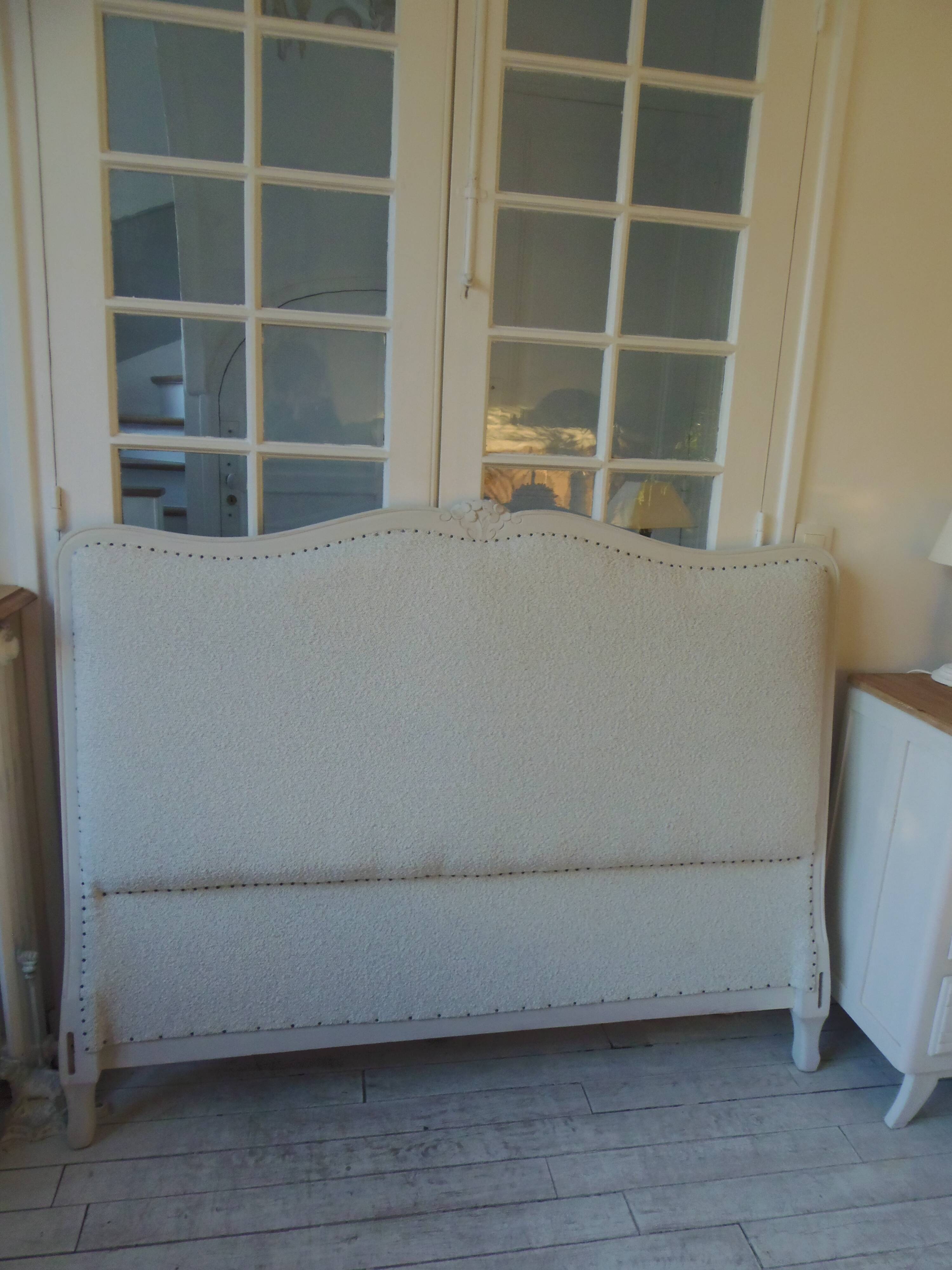Louis XV style headboard with pearl grey patina, upholstered in off-white bouclette.