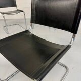 Lot of 4 tubular chairs designed by Mart Stam in vintage black leather from the 1980s.