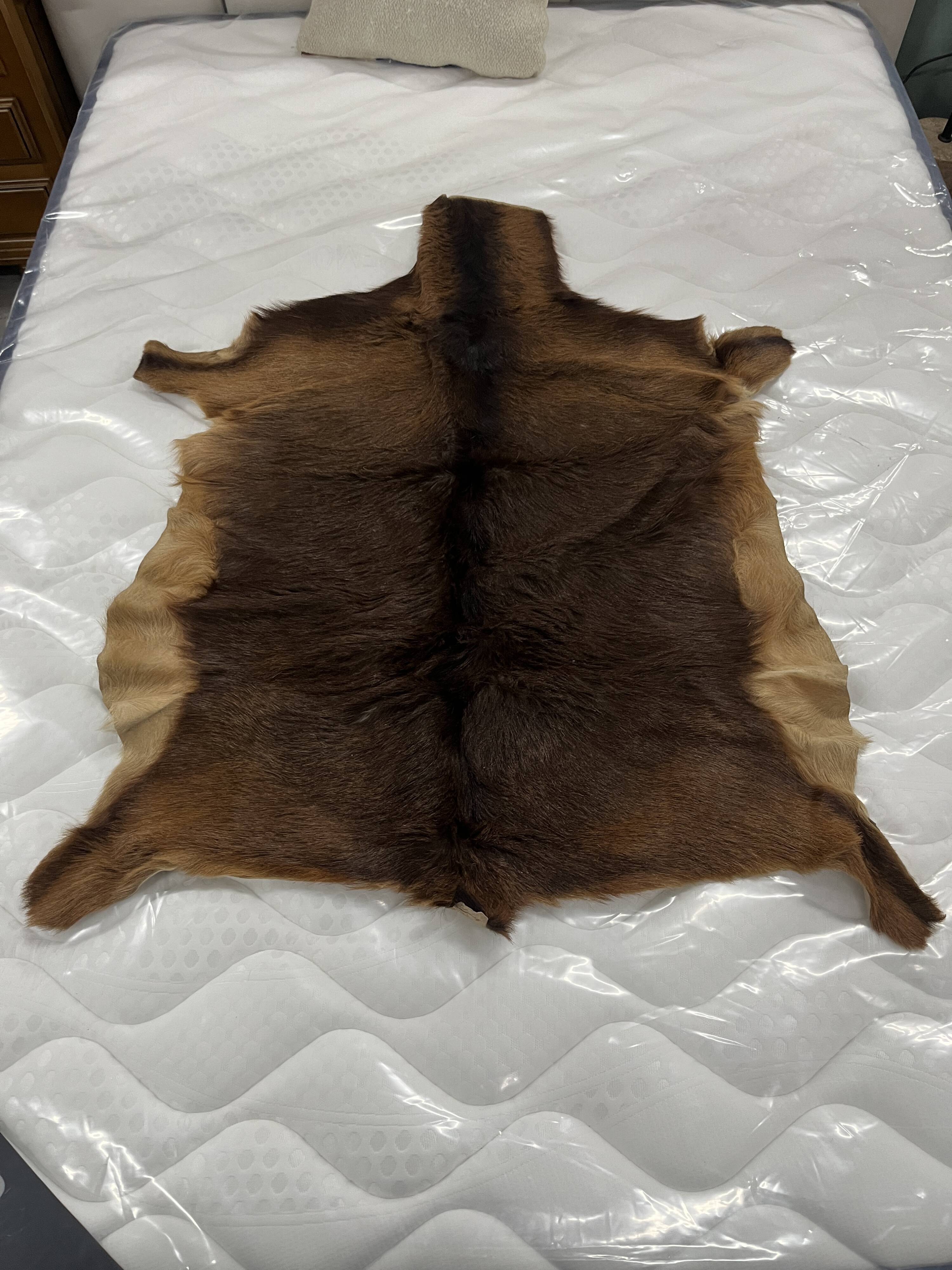 Goat skin rug, 20th century.