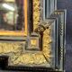 Napoleon III mirror in blackened wood and gilded decoration, second half of the 19th century.