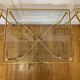 Table basse tripartite en laiton et verre