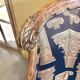 Armchair in a wooden confessional style with black and beige cotton.