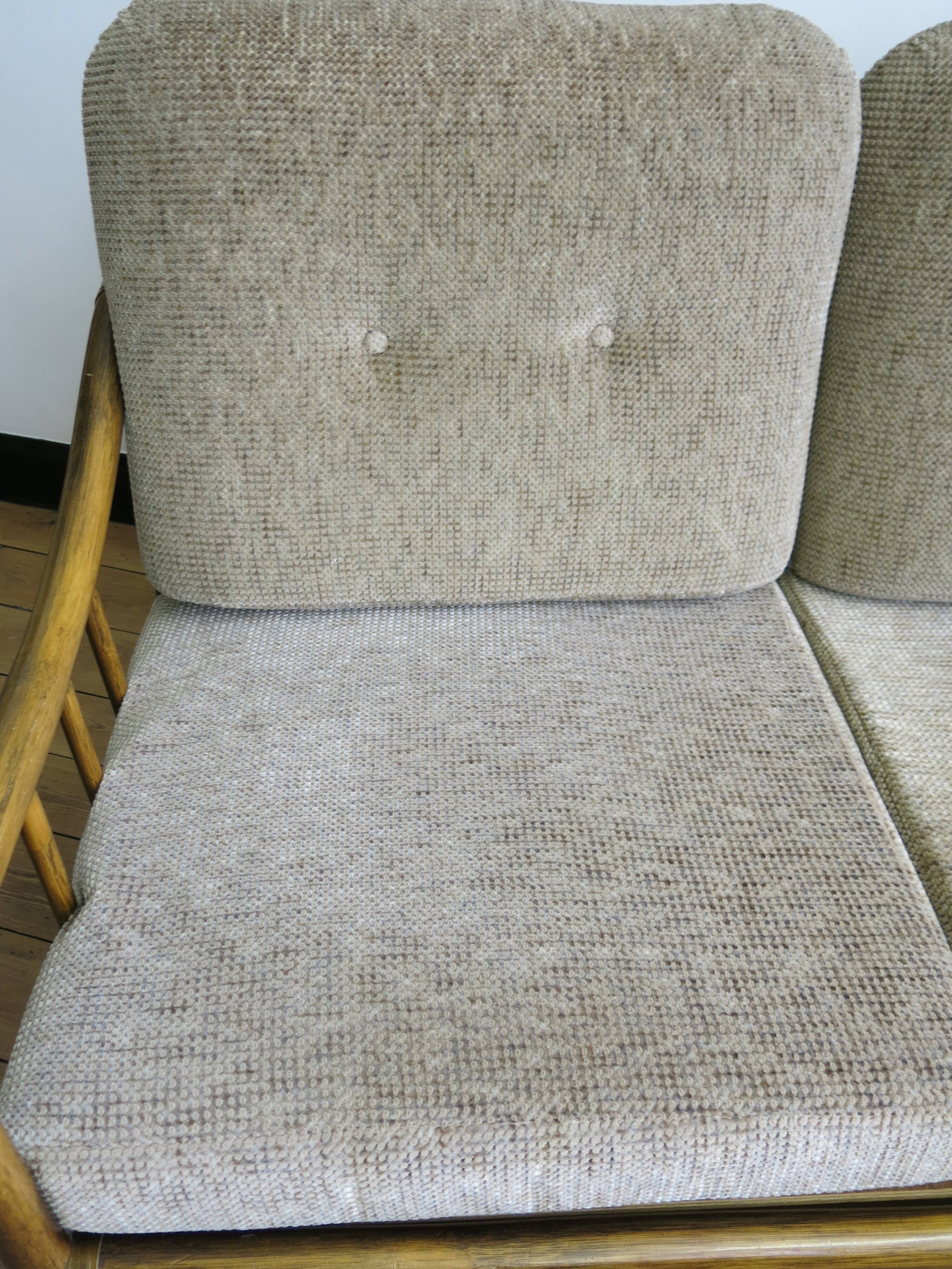 Two-seater rattan sofa with natural tones