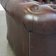 Beautiful and spacious dark brown mottled English cow leather Chesterfield armchair