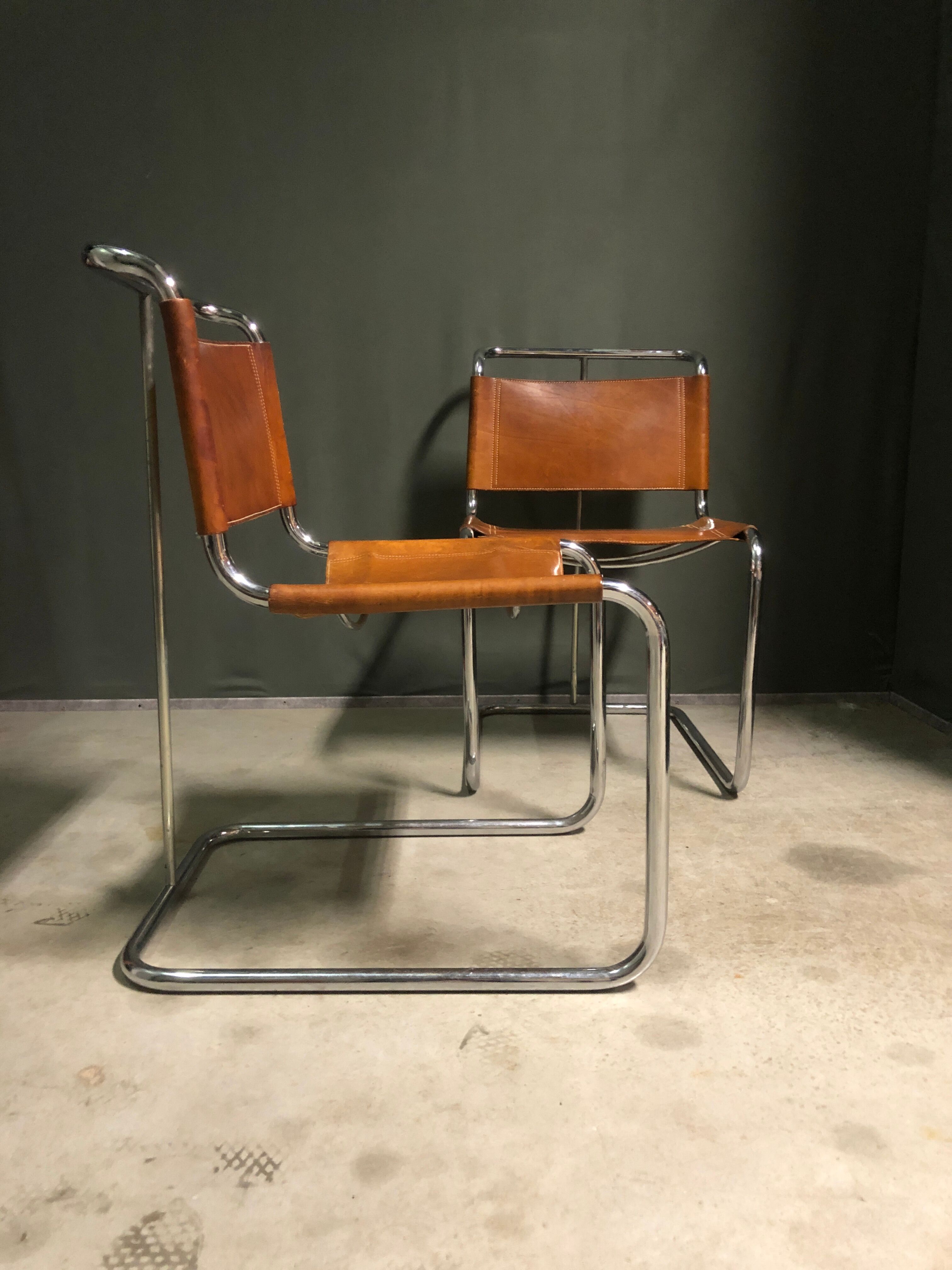 A pair of chromed tubular dining chairs 1980's