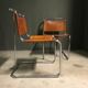 A pair of chromed tubular dining chairs 1980's