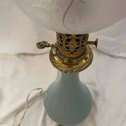 Oil lamp in celadon and bronze with its original glass globe, 19th century.