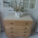 Vintage oak chest of drawers, a travertine plate laid for tray.