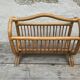 Magazine rack in braided rattan of the 60s