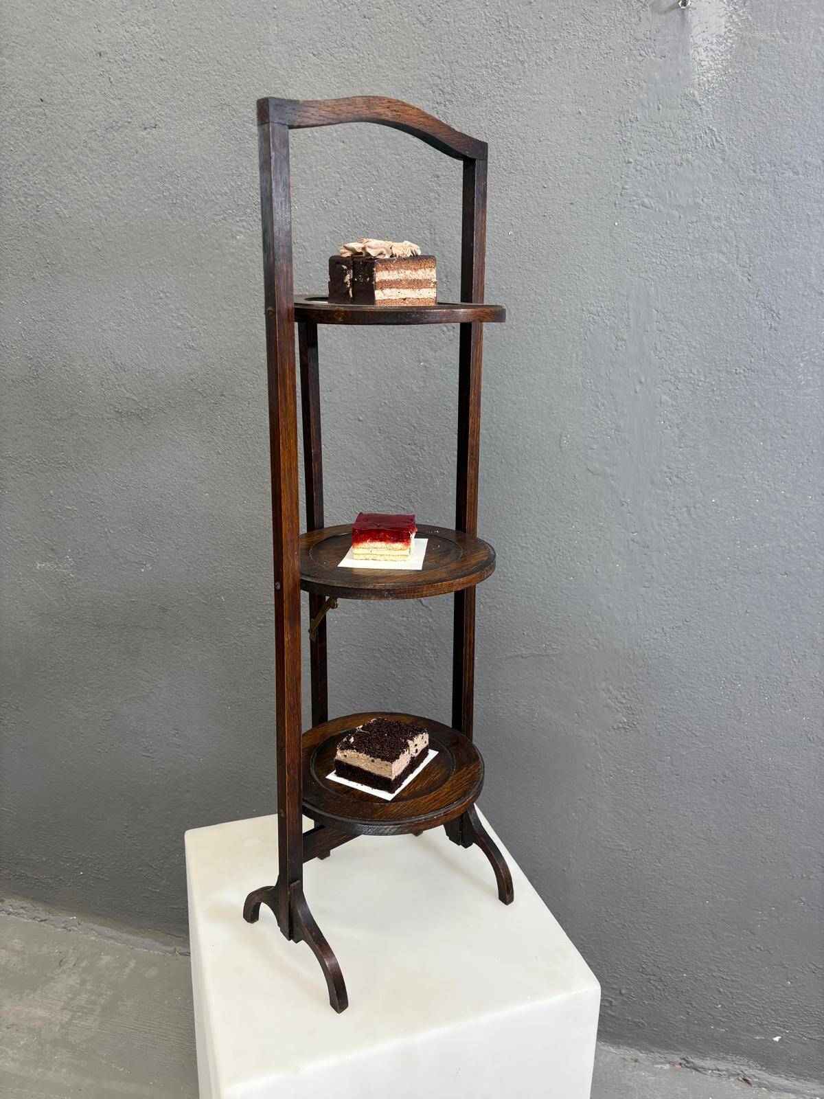 Vintage 3-tier cake stand in dark wood, 1920s serving display.