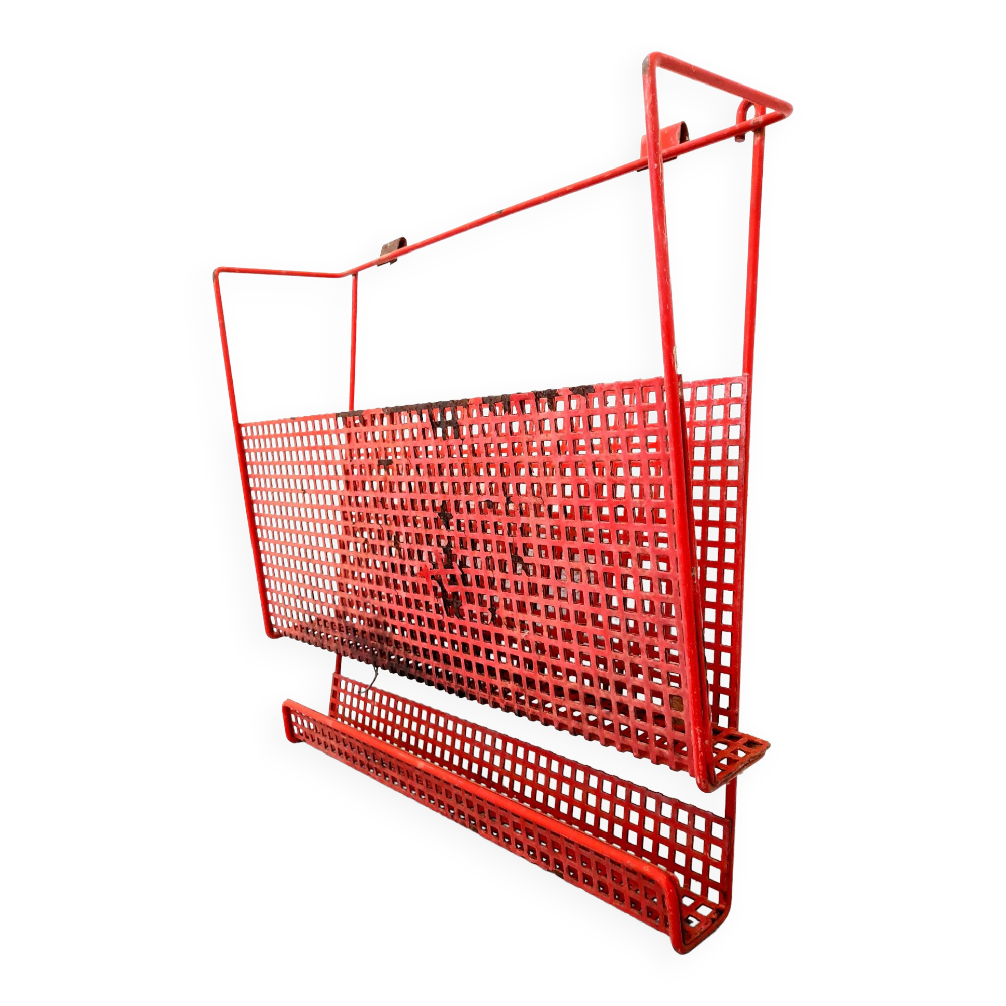 Vintage magazine rack in red lacquered perforated metal from the 70s