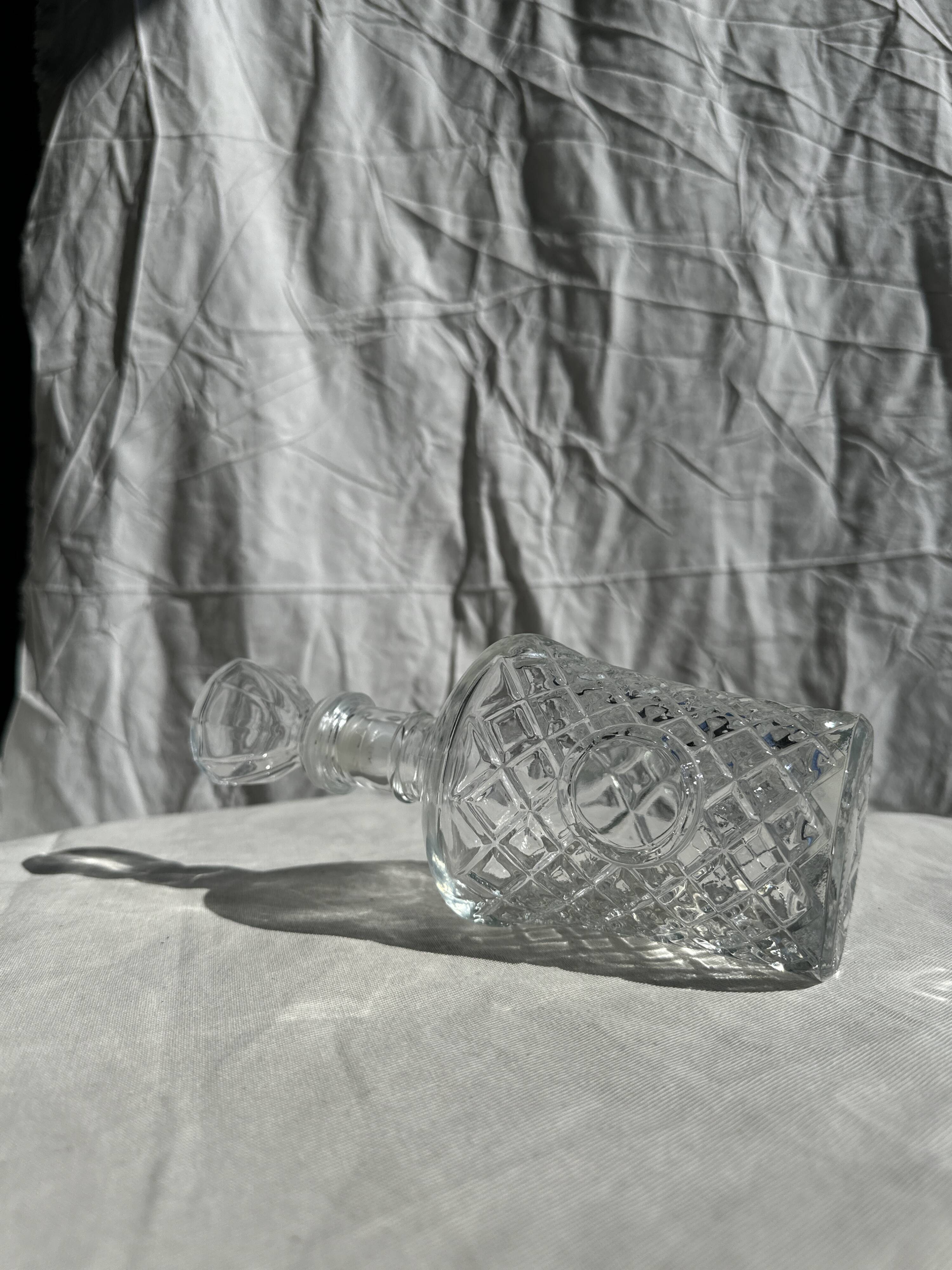 Small cylindrical glass whiskey decanter H:23