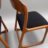 Pair of vintage Baumann sled chairs with curved wood in honey colour.
