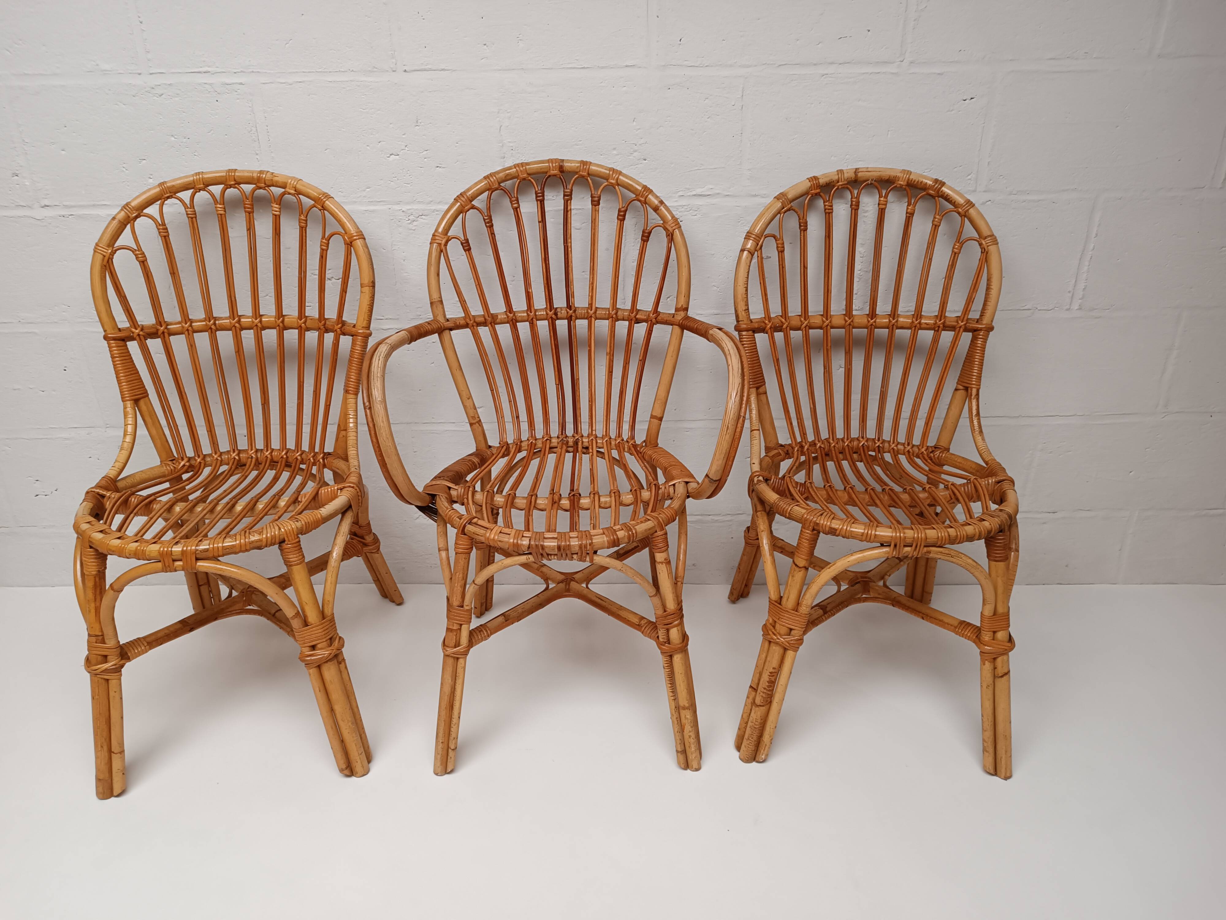 Bamboo table with extensions, 3 chairs and 3 stools from the 1960s.
