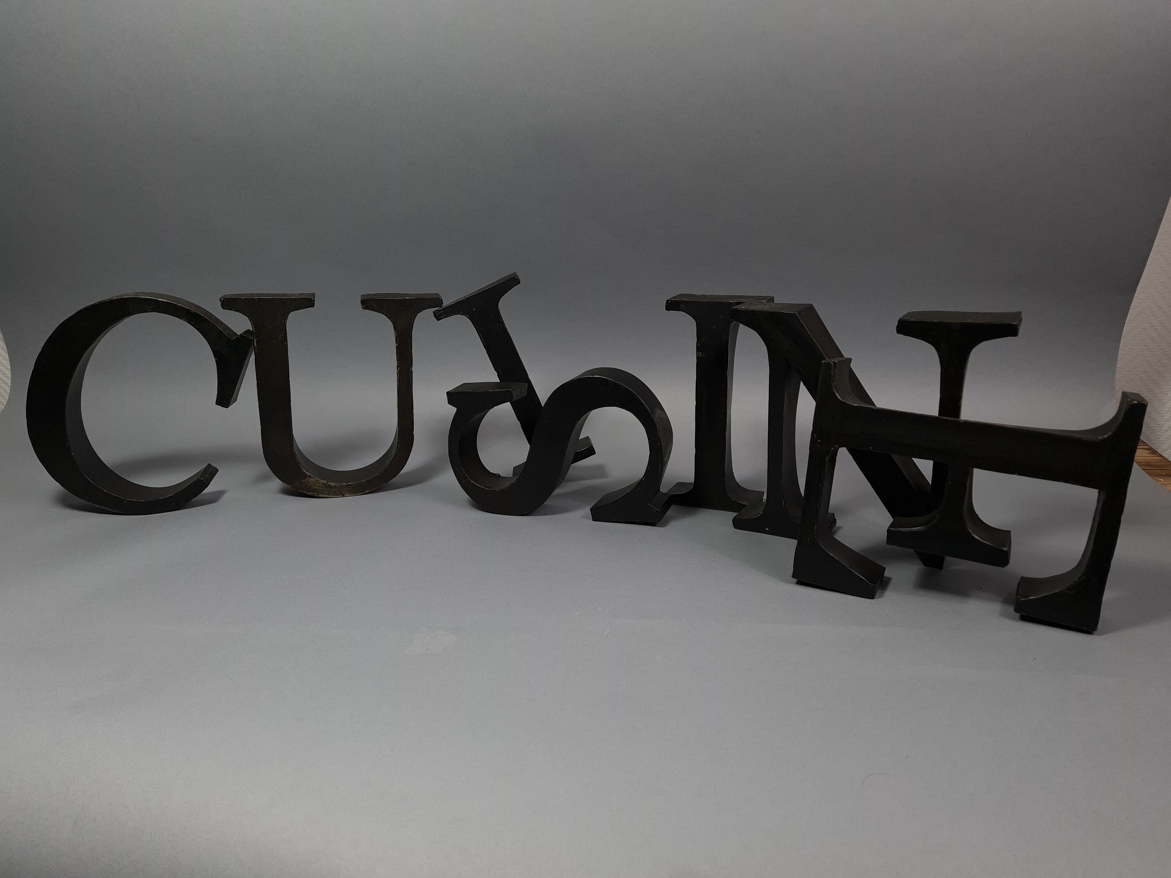 "kitchen" lettering set in blackened metal