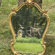 Beveled gilded wood mirror with violin shapes, Louis XV baroque style shell