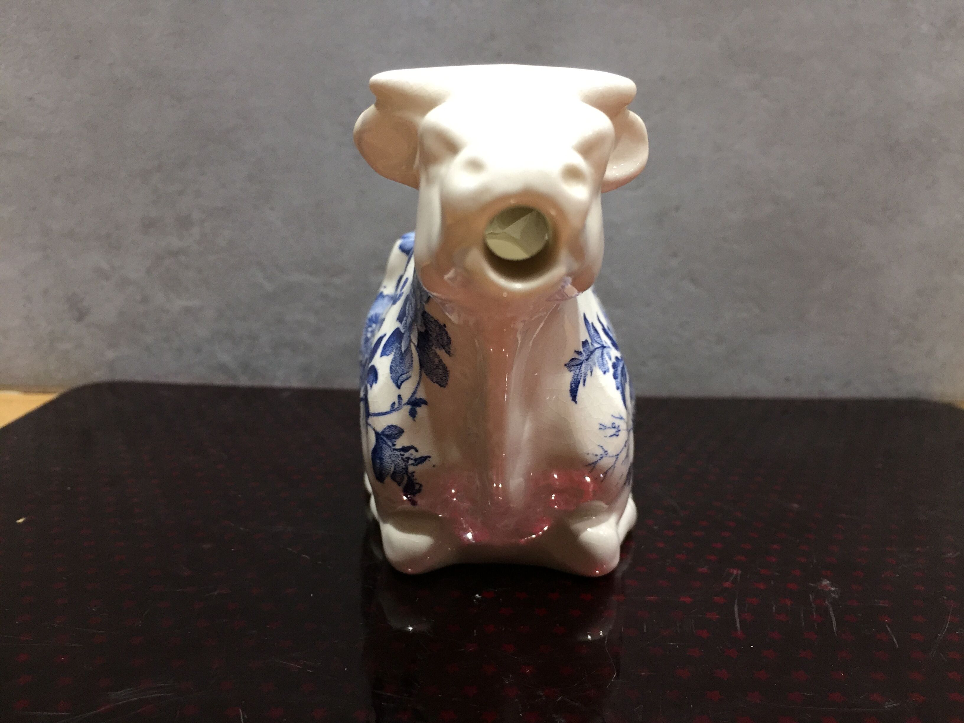 English porcelain cow-shaped sauce dish