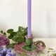 Antique slip candlestick depicting a flower